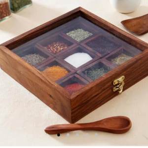 This sheesham wooden box with 9 sections and a spoon is great to store Indian spices.